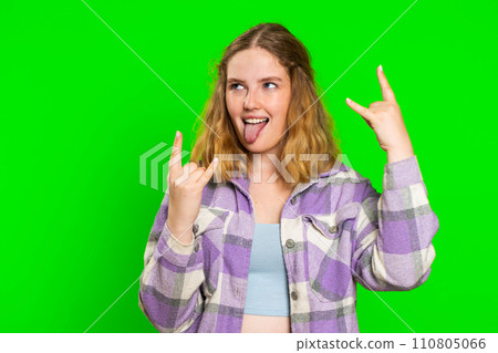 Happy woman showing rock n roll gesture by hands, cool sign, crazy expression dancing, victory, win 110805066