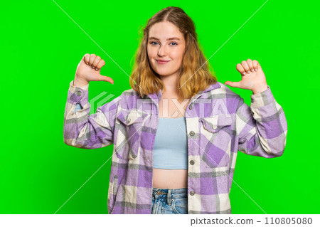 Young woman feeling very proud pointing herself overjoyed by success, making choice, self-confident 110805080