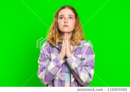 Caucasian sad woman praying making wish, asking hopeful help, begging apology, meditation, imploring 110805088