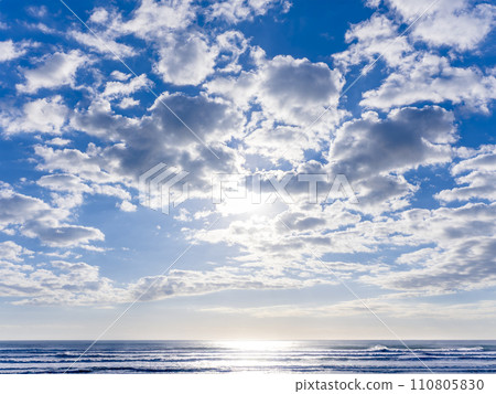Shining sea surface and blue sky with white clouds Shining sea surface and blue sky with white clouds 110805830