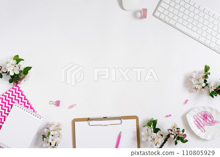 Flat lay home office workspace female blogger background with white modern keyboard, notebook and apple flowers, copy space on white background Flat lay home office workspace female blogger background with white modern keyboard, notebook and apple flowers, copy space on white background 110805929