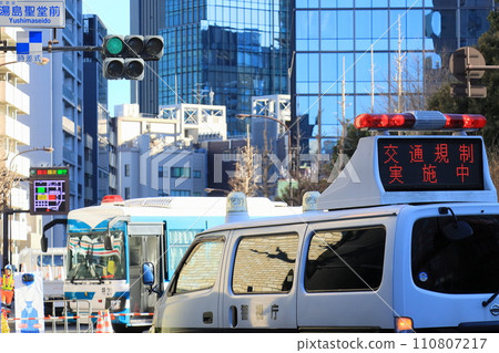 Police vehicle regulating traffic Road closure by police vehicle Police vehicle regulating traffic Road closure by police vehicle 110807217