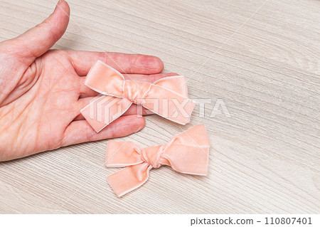 Beautiful hair bow for girls. Fashion accessory for girls hair on white background. 110807401