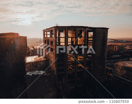 Aerial view of old abandoned building, skyscraper in the city. Old derelict building in bad state. Aerial view of old abandoned building, skyscraper in the city. Old derelict building in bad state. 110807850