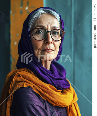Portrait of Stern-Faced Elderly Woman with Purple Headscarf and Yellow Shawl 110808069
