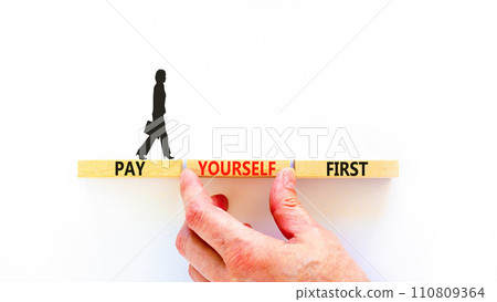 Pay yourself first symbol. Concept words Pay yourself first on beautiful wooden blocks. Beautiful white table white background. Businessman hand. Business and pay yourself first concept. Copy space. Pay yourself first symbol. Concept words Pay yourself first on beautiful wooden blocks. Beautiful white table white background. Businessman hand. Business and pay yourself first concept. Copy space. 110809364