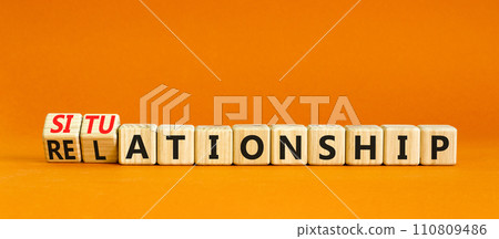 Relationship or situationship symbol. Concept word Relationship situationship on wooden cubes. Beautiful orange table orange background. Business relationship situationship concept. Copy space. 110809486