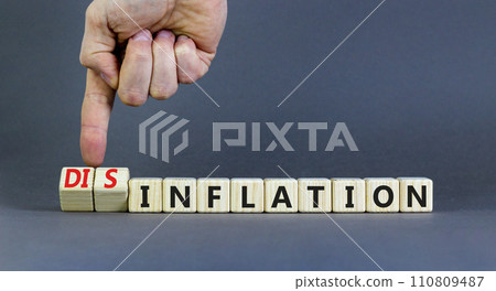 Inflation or disinflation symbol. Concept word Inflation Disinflation on beautiful wooden cubes. Beautiful grey background. Businessman hand. Business inflation disinflation concept. Copy space. 110809487