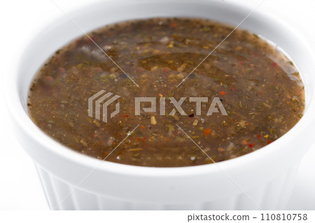 Green Chimichurri Sauce isolated on white background Green Chimichurri Sauce isolated on white background 110810758