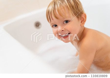 Cute baby boy in bathtub. Happy child taking bath. Cute baby boy in bathtub. Happy child taking bath. 110810809