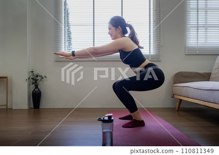 Young asian healthy happy woman workout at home, exercise, doing yoga, home fitness concept Young asian healthy happy woman workout at home, exercise, doing yoga, home fitness concept 110811349