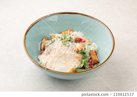 Portion of caesar salad with chicken 110812517