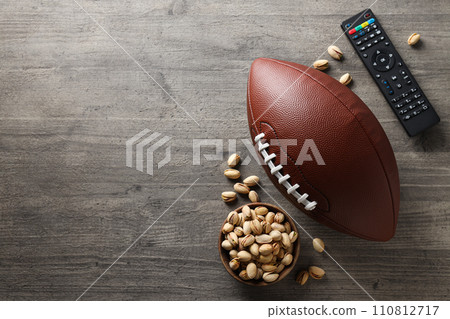 Bowl of popcorn with rugby ball, Super Bowl concept 110812717