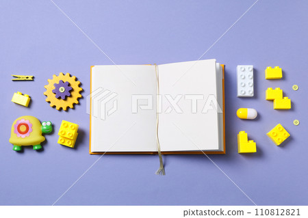 Children's book, with toys, on a purple background. Children's book, with toys, on a purple background. 110812821