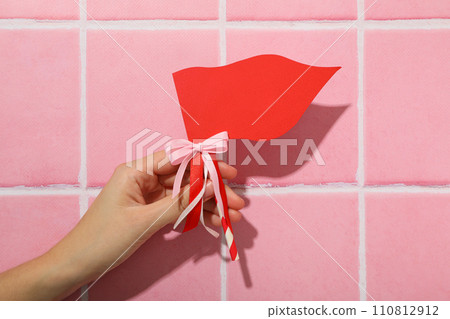 Red flag, accessory for Valentine's Day on a pink background. 110812912