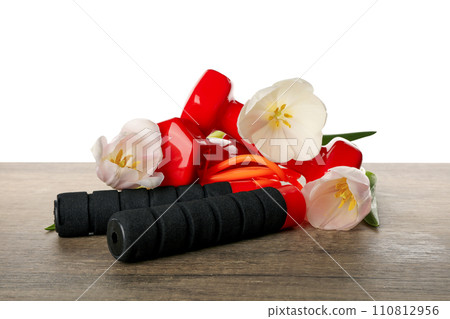 PNG sports goods with flowers on table isolated on white background. 110812956