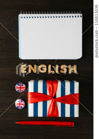 The concept of learning English, a notebook on a blue background. 110813036