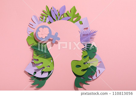 Paper female head with paper decorative leaves 110813056