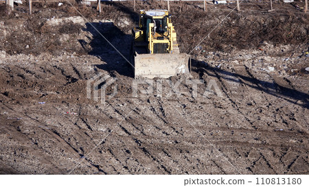 Kiev, Ukraine March 13, 2019: Tractors and excavators work on the construction of the foundation zero cycle Kiev, Ukraine March 13, 2019: Tractors and excavators work on the construction of the foundation zero cycle 110813180