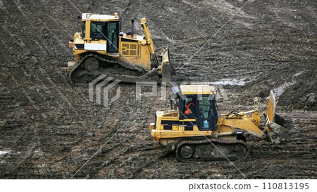 Kiev, Ukraine March 13, 2019:  Tractors and excavators work on the construction of the foundation zero cycle 110813195