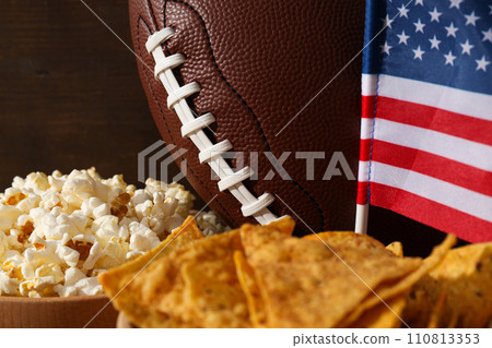Beer snacks with a rugby ball and an American flag 110813353