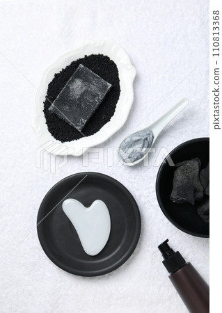 Set of cosmetics with charcoal on a light background. Set of cosmetics with charcoal on a light background. 110813368