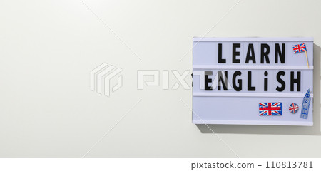 Blackboard with the inscription "English lessons" on a light background. Blackboard with the inscription "English lessons" on a light background. 110813781