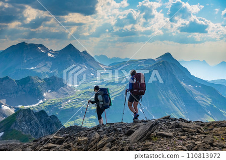 Two sporty woman hiking in Switzerland alps. Heathy lifestyle, sport, beauty in nature. Grindelwald valley, Swizz 110813972