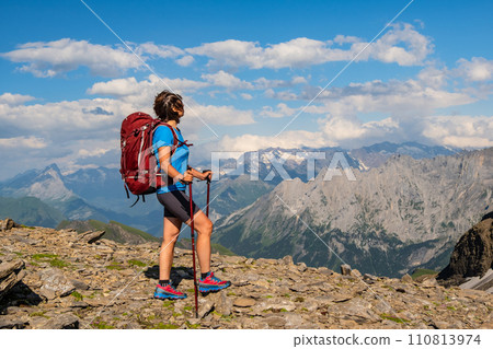 Sporty woman hiking in Switzerland alps. Heathy lifestyle, sport, beauty in nature. Grindelwald valley, Swizz Sporty woman hiking in Switzerland alps. Heathy lifestyle, sport, beauty in nature. Grindelwald valley, Swizz 110813974