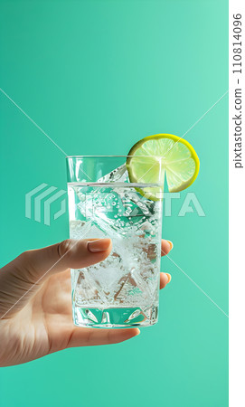 AI-generated content. Summer concept - hand holding gin and tonic coctail, solid color background AI-generated content. Summer concept - hand holding gin and tonic coctail, solid color background 110814096