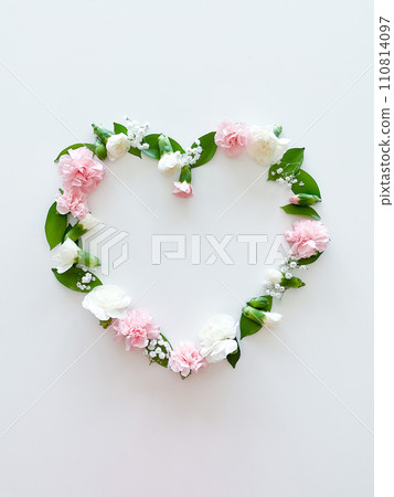 Frame in form of heart from pink, white carnations Frame in form of heart from pink, white carnations 110814097