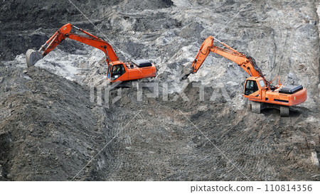 Kiev, Ukraine, October 17, 2018: Workers in the mud of a construction site at the stage of excavation; construction of a supermarket AUCHAN Kiev, Ukraine, October 17, 2018: Workers in the mud of a construction site at the stage of excavation; construction of a supermarket AUCHAN 110814356