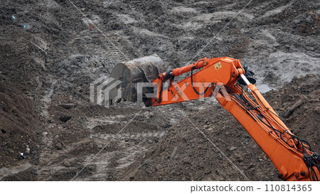 Kiev, Ukraine, October 17, 2018: Workers in the mud of a construction site at the stage of excavation; construction of a supermarket AUCHAN Kiev, Ukraine, October 17, 2018: Workers in the mud of a construction site at the stage of excavation; construction of a supermarket AUCHAN 110814365