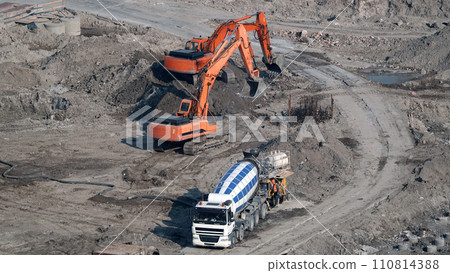 Kiev, Ukraine, October 17, 2018: Workers in the mud of a construction site at the stage of excavation; construction of a supermarket AUCHAN 110814388