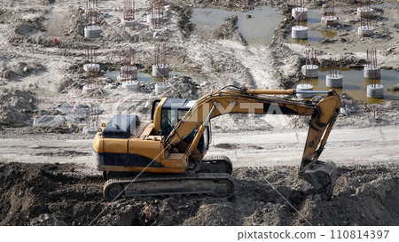 Kiev, Ukraine, October 17, 2018: Workers in the mud of a construction site at the stage of excavation; construction of a supermarket AUCHAN 110814397