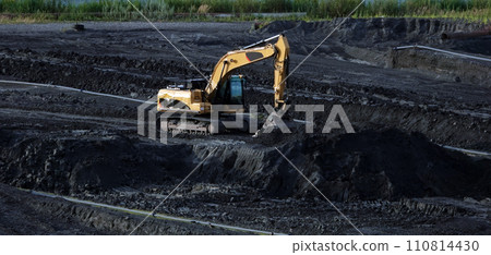 Kiev, Ukraine, October 17, 2018: Workers in the mud of a construction site at the stage of excavation; construction of a supermarket AUCHAN 110814430