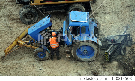 Kiev, Ukraine March 13, 2019: Workers repair equipment on the construction of the zero cycle foundation of the entertainment center 110814508