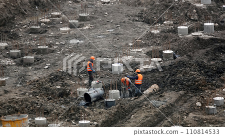 Kiev, Ukraine March 13, 2019:  Workers and machinery - zero-cycle construction of the foundation of an entertainment center 110814533