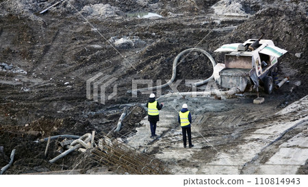 Kiev, Ukraine March 13, 2019:  Workers and machinery - zero-cycle construction of the foundation of an entertainment center 110814943
