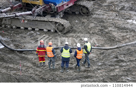Kiev, Ukraine March 13, 2019:  Workers and machinery - zero-cycle construction of the foundation of an entertainment center 110814944