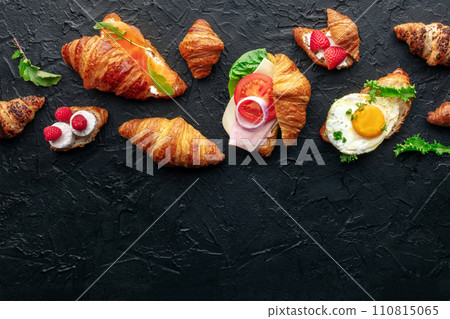 Croissant sandwich assortment. Various stuffed croissants, overhead 110815065