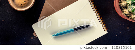 Notebook mockup with a pen, coffee, and plant, overhead flat lay Notebook mockup with a pen, coffee, and plant, overhead flat lay 110815101