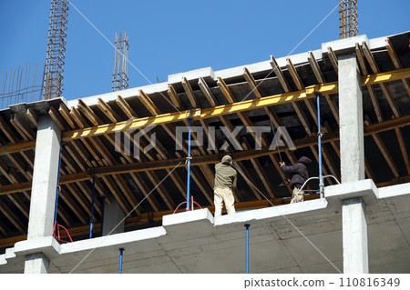 Kiev, Ukraine March 18, 2020: Workers at high altitude 110816349