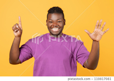 African American guy raising both hands showing number six, studio African American guy raising both hands showing number six, studio 110817081