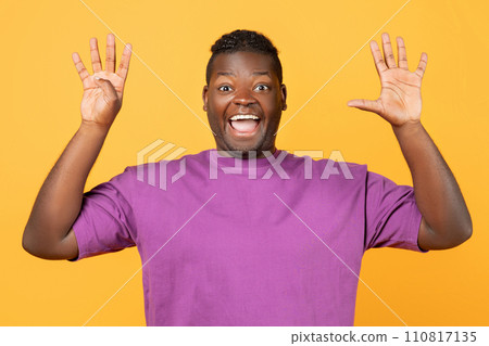 Excited African man raising both hands showing number nine, studio Excited African man raising both hands showing number nine, studio 110817135