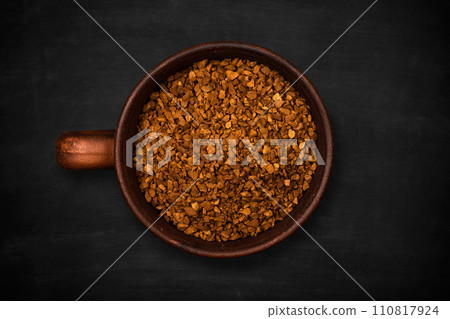 Top view of a cup of instant coffee on a black background, close up 110817924