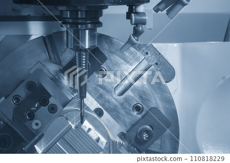 The 5-axis CNC milling machine cutting the automotive part with solid ball end mill tool. The 5-axis CNC milling machine cutting the automotive part with solid ball end mill tool. 110818229