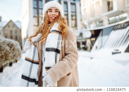 Portrait of young woman in the winter street. Fashion style. 110818475