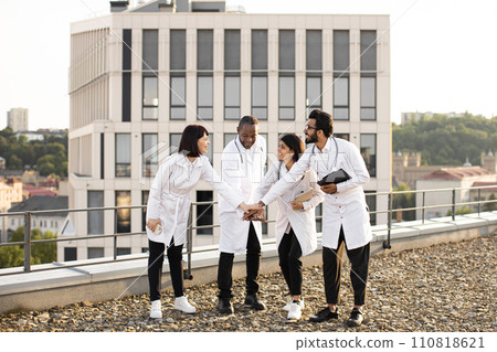 Meeting of multinational doctors in modern clinic during break. Meeting of multinational doctors in modern clinic during break. 110818621