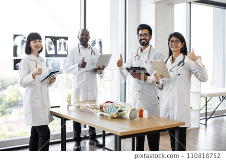 Medical students on anatomy lesson in classroom showing, thumbs up Medical students on anatomy lesson in classroom showing, thumbs up 110818752